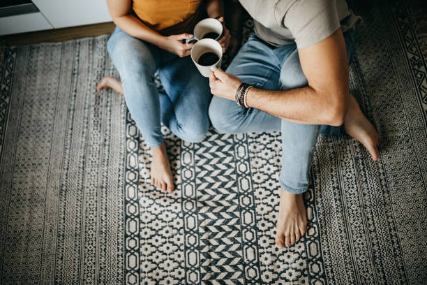 Couple enjoying black coffee | Location Carpet Inc.